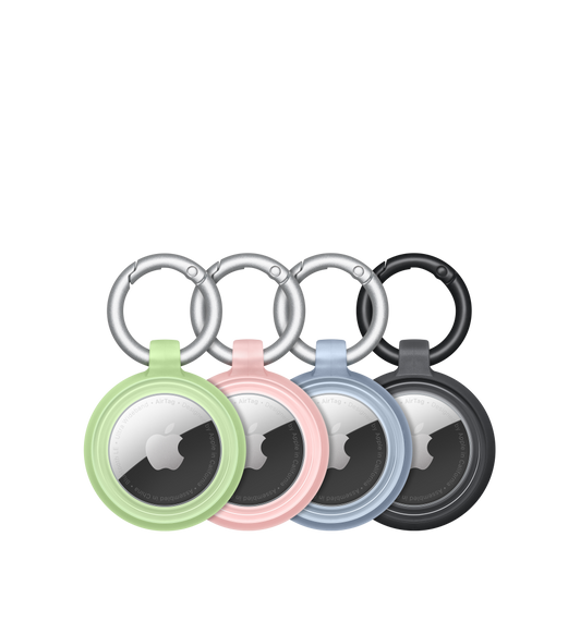Cuatro fundas Lumen Series de OtterBox puestas en unidades de AirTag con el logo de Apple en el centro