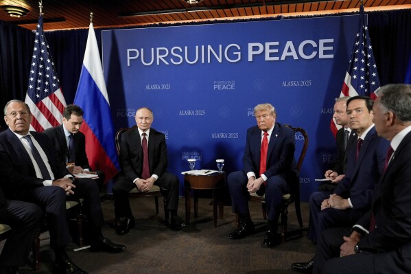 President Donald Trump meets with Russia's President Vladimir Putin Friday, Aug. 15, 2025, at Joint Base Elmendorf-Richardson, Alaska. At left is Russia's Foreign Minister Sergey Lavrov and second from right is Secretary of State Marco Rubio. (AP Photo/Julia Demaree Nikhinson)