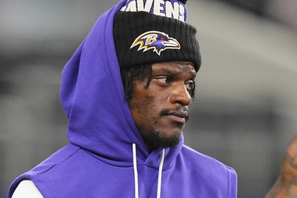 Baltimore Ravens' Lamar Jackson stands on the field during team warmups before a preseason NFL football game against the Dallas Cowboys Saturday, Aug. 16, 2025, in Arlington, Texas. (AP Photo/LM Otero)