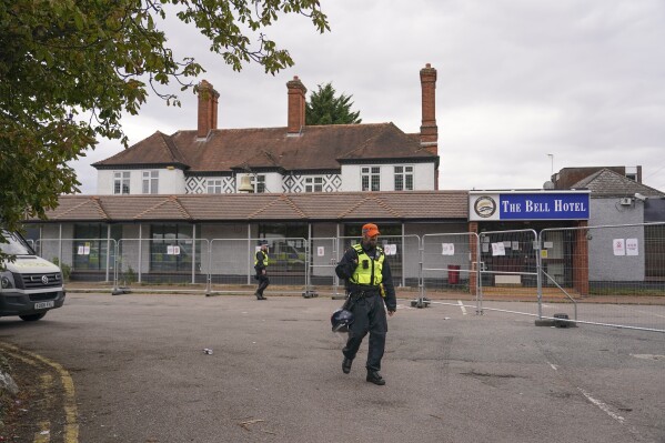 A police officer walks outside The Bell Hotel in Epping, near London, Sunday, July 27, 2025.(AP Photo/Alberto Pezzali)