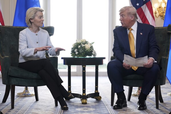 President Donald Trump and European Commission President Ursula von der Leyen talk after reaching a trade deal at the Trump Turnberry golf course in Turnberry, Scotland Sunday, July 27, 2025. (AP Photo/Jacquelyn Martin)