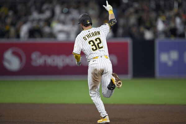 San Diego Padres' Ryan O'Hearn rounds the bases after hitting a solo home run during the seventh inning of a baseball game against the San Francisco Giants Wednesday, Aug. 20, 2025, in San Diego. (AP Photo/Orlando Ramirez)