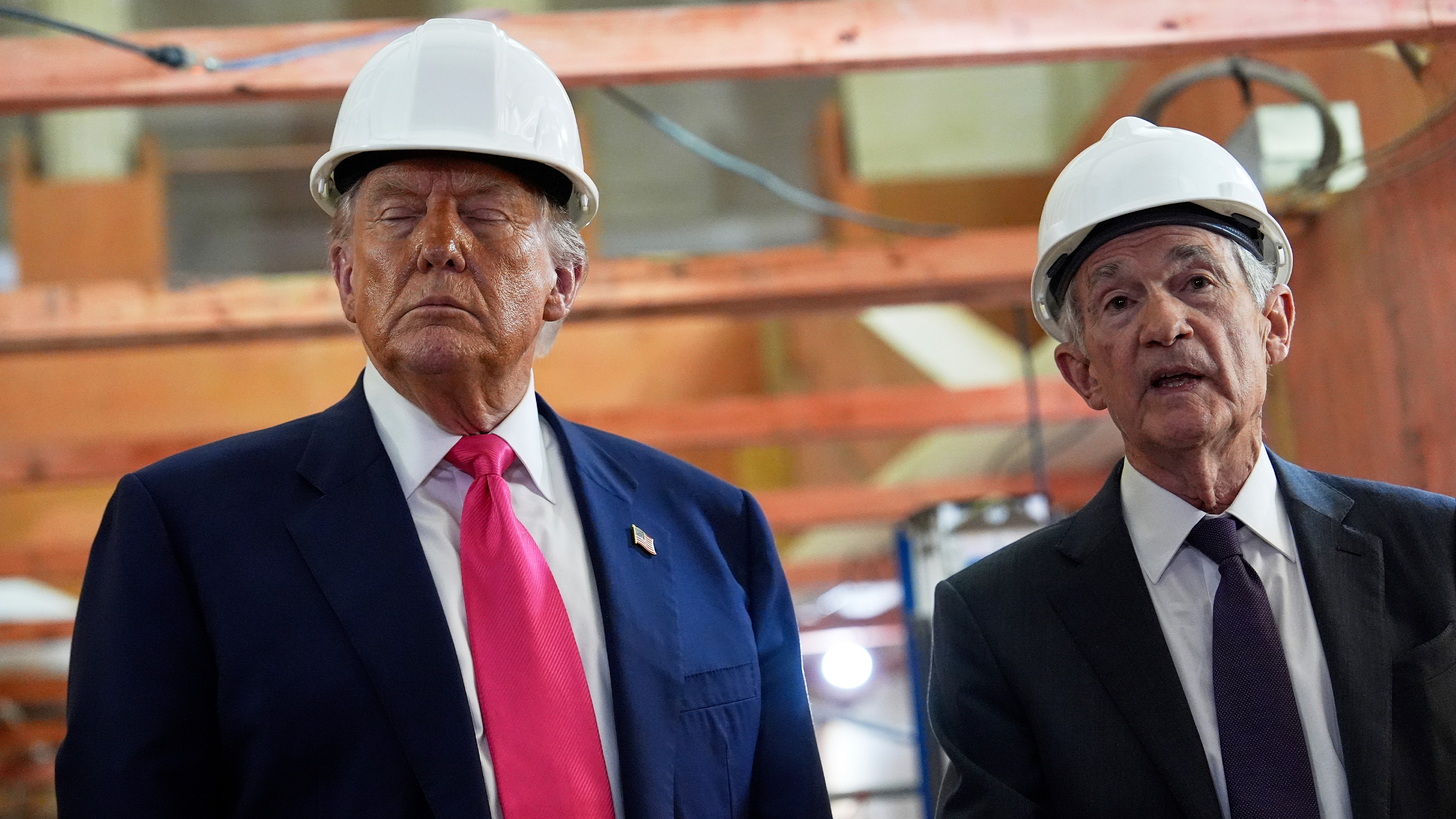 President Donald Trump listens as Federal Reserve Chairman Jerome Powell speaks during a visit to the Federal Reserve, Thursday, July 24, 2025, in Washington.