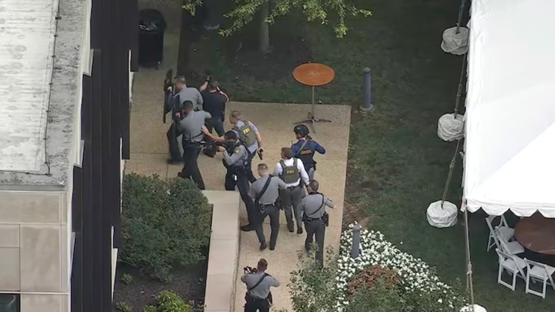 In this screenshot from Chopper 6 video, law enforcement officials are shown at the scene of a shooting at Villanova University, Aug. 21, 2025.