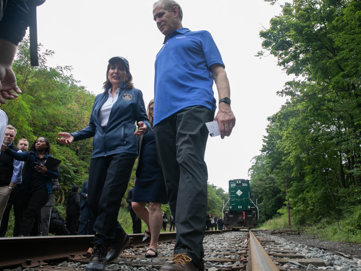 Gov. Kathy Hochul and MTA Chair Janno Lieber walk along tracks in Borough Park slated to become part of the Interborough Express, Aug. 1, 2025.
